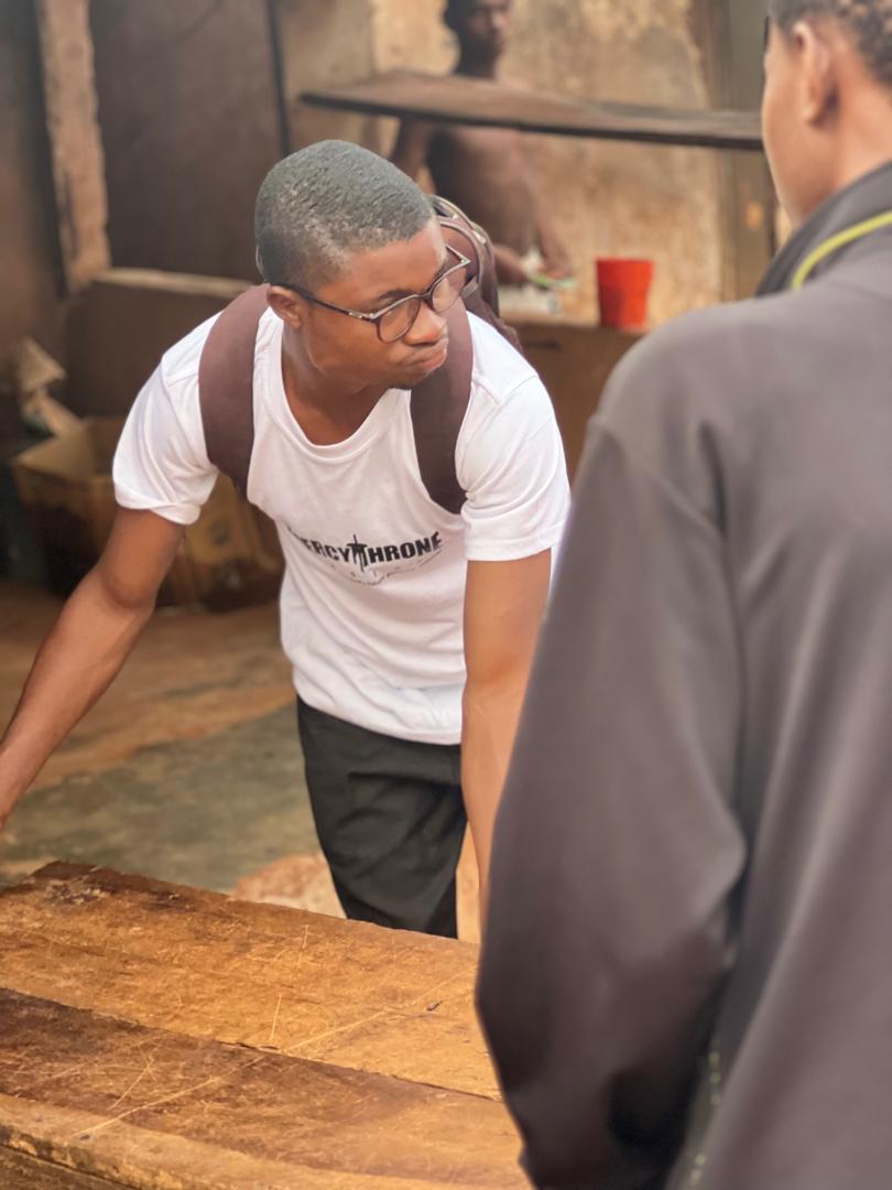 A volunteer speaking with someone during a community visit