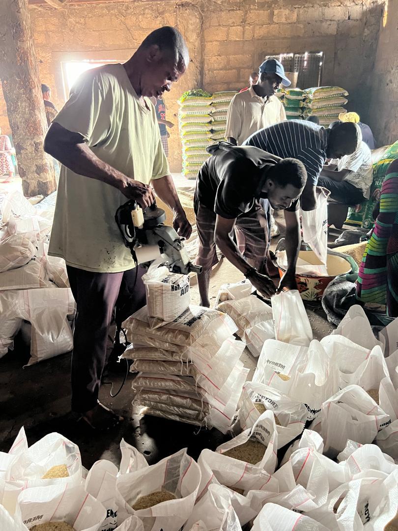Local team members packing food support bags